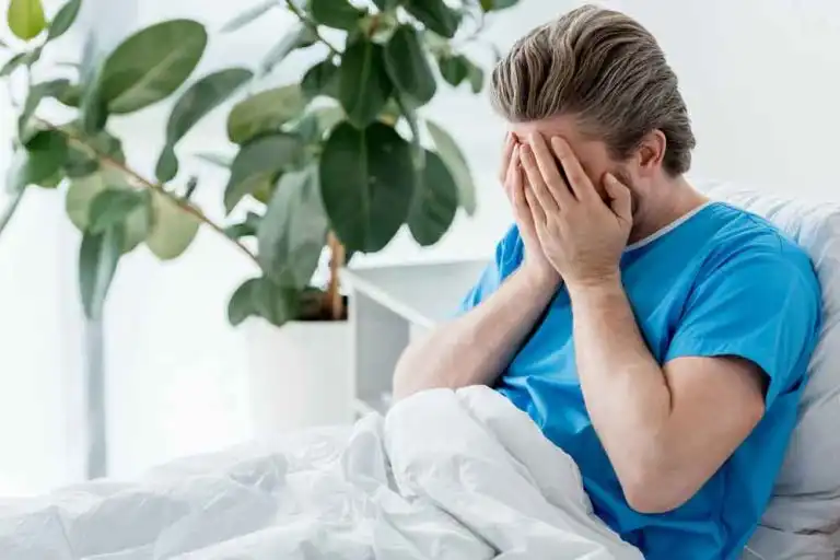 man-in-hospital-bed