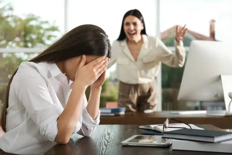 Boss screaming at employee in office. Toxic work environment