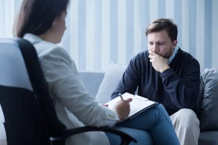 a doctor consulting man for the ptsd