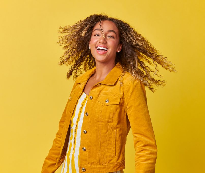 Through Suboxone treatments, at PsychPlus, we prioritize your well-being, featuring a curly hair woman