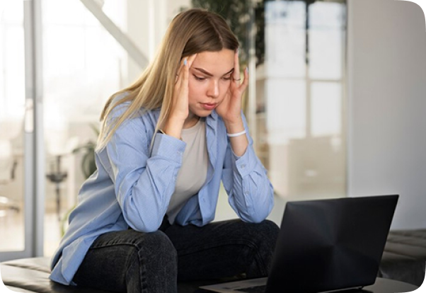 Running a solo mental health practice can lead to stress featuring a woman using laptop